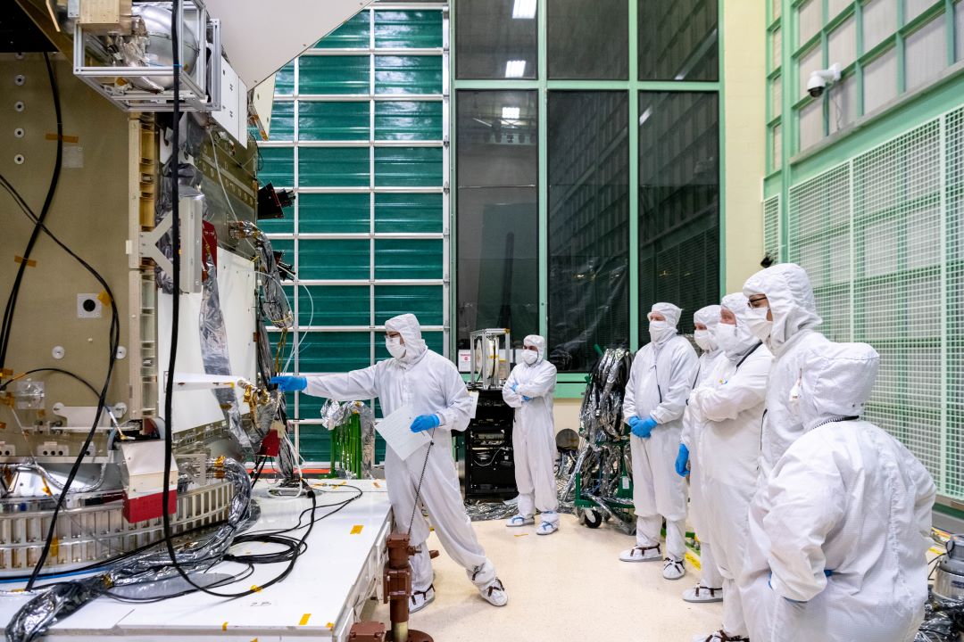 The Plankton, Aerosol, Cloud, ocean Ecosystem (PACE) team working in the clean room.